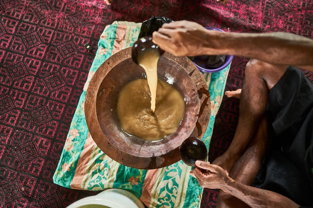 Pacific Islander farmers in stunning Fiji landscape at sunrise
